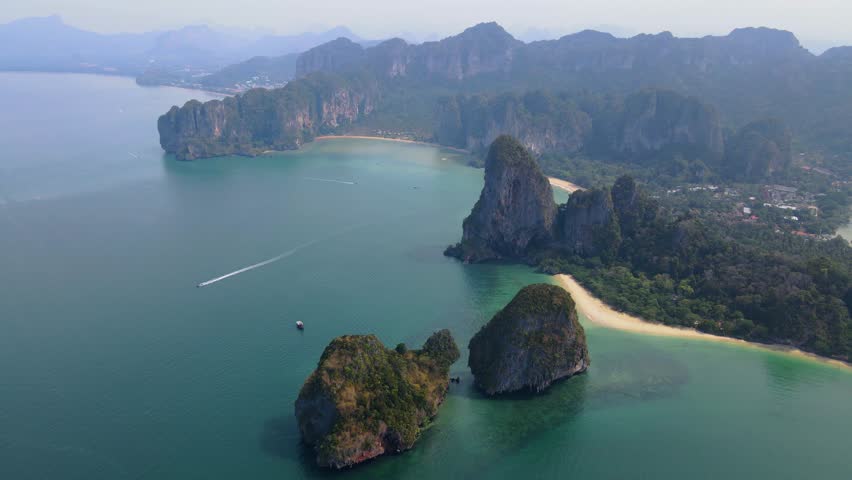 Railay Beach Krabi Thailand a tropical beach with a turqouse colored ocean, Railay Krabi view from a drone of idyllic Railay Beach in Thailand  Royalty-Free Stock Footage #3430033921