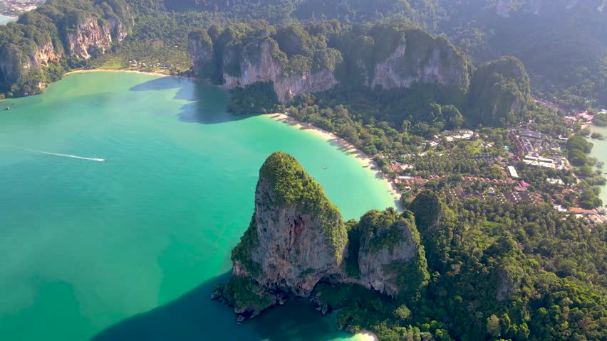 Railay Beach Krabi Thailand a tropical beach with a turqouse colored ocean, Railay Krabi view from a drone of idyllic Railay Beach in Thailand  Royalty-Free Stock Footage #3430034447