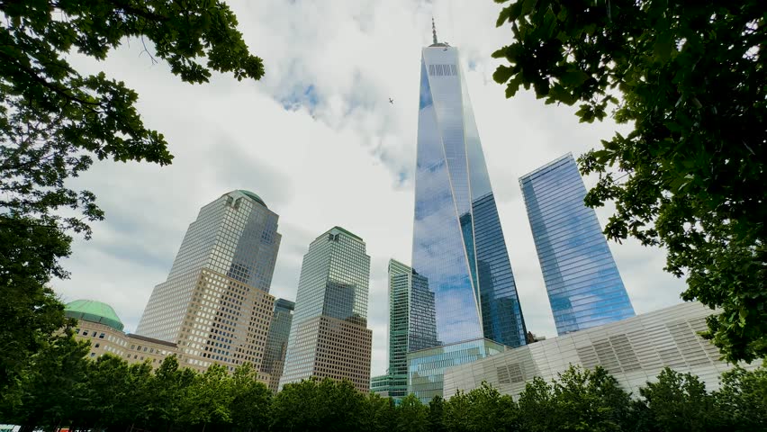 New York skyscrapers. Downtown in Manhattan. Financial center of the city. Lower. Wall Street. One World Trade Center. Skyscrapers day and night in New York. Ground Zero Memorial. Museum Foundation.
