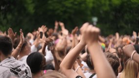Lot people hang out live music concert. Many fans cheering epic rave gig. Joy crowd energy. Wild pop fest party. Men raise hand up arm fists. Cool funky open air concert. Teens have fun chill festival - Powered by Shutterstock - Get 15% off with code: PIKWIZARD15