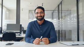 Happy Indian business man hr, online teacher or executive manager having hybrid interview meeting, talking communicating online on conference call working in office. Web cam view. - Powered by Shutterstock - Get 15% off with code: PIKWIZARD15