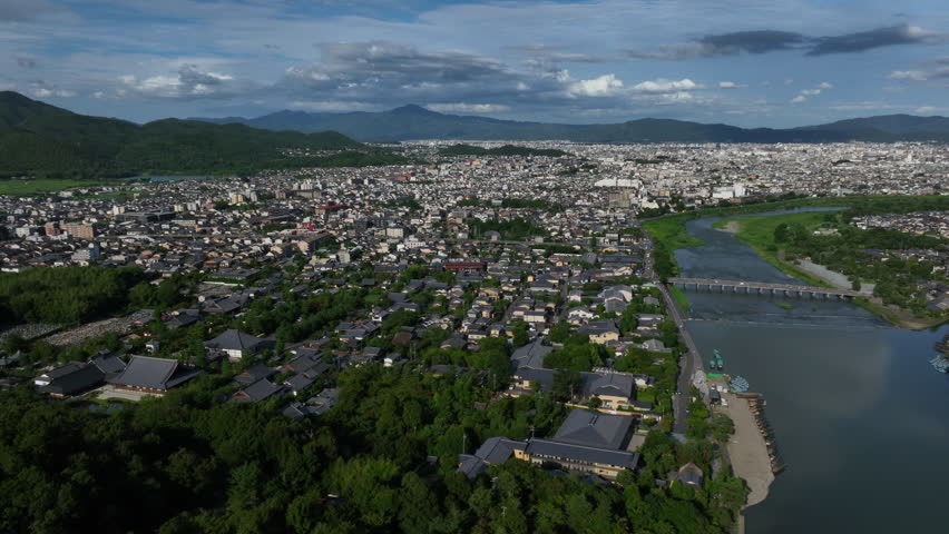 Aerial pan shot of the Sagatenryuji Susukinobabacho area, summer in Kyoto, Japan
