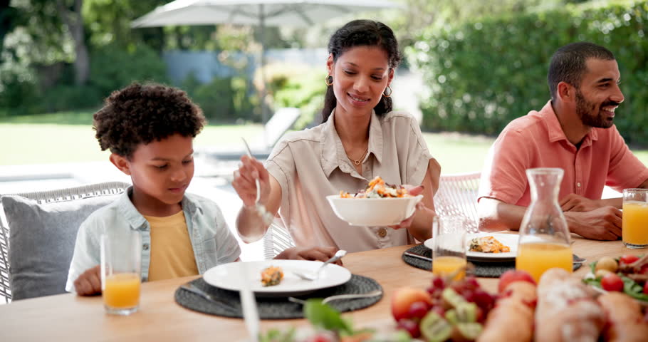 Food, love and happy with family at lunch for bonding, nutrition and thanksgiving event. Health, social and holiday with people at table of dining room at home for helping, celebration and brunch