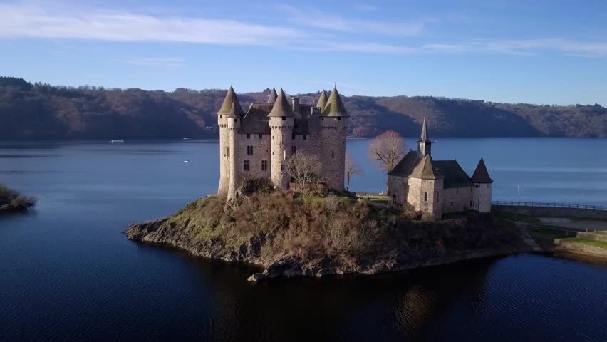 drone shot around Chateau de Val, beautiful french castle in Cantal departement, auvergne rhone alpes region, french countryside