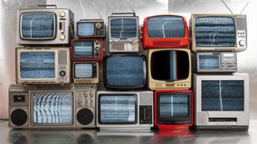 Amazing collection of vintage and retro televisions made into a tv wall with static and glitch on the screen