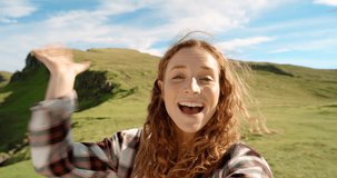 Video call, nature and excited woman on holiday for hiking on a mountain in Sweden. Blowing kiss, selfie and happy female person on outdoor adventure with freedom and waving hello for greeting