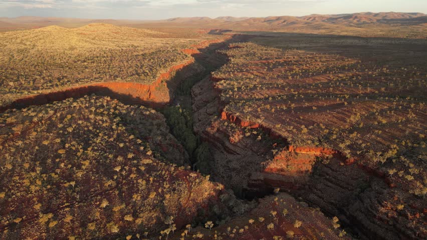 Canyon intersection at Dales Gorge during sunset in Karijini National Park in Western Australia, aerial high altitude