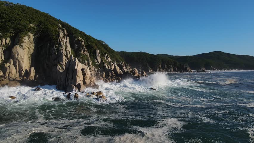 Aerial view ocean power nature's wild beauty breathtaking scene untamed sea Ocean power relentless against cliffs unstoppable force. Ocean power nature's unyielding will majestic display of raw force
