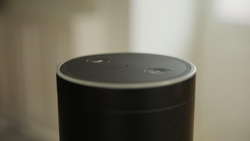 Close up of smart speaker activating after being spoken to