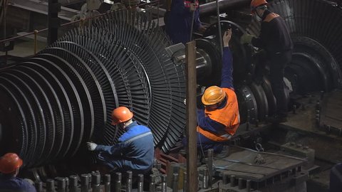 7 September 2017. Russia. Novosibirsk. Thermal power plant. Engineer taking notes for maintenance steam turbine of thermal power plant