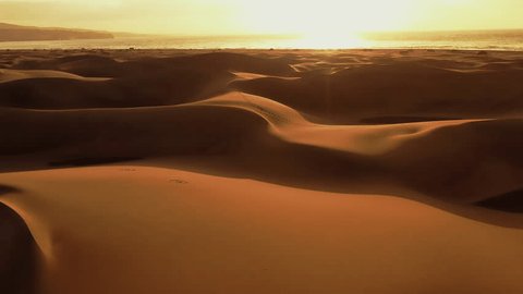 Aerial view of the dunes of Maspalomas, a protected nature reserve, between Maspalomas and Playa del Inglés, Gran Canaria, Canary Islands, Spain. の動画素材