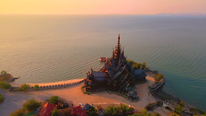 Sanctuary of Truth, Pattaya, Thailand, wooden temple by the ocean during sunset on the beach of Pattaya Chonburi Thailand Royalty-Free Stock Footage #3430504035