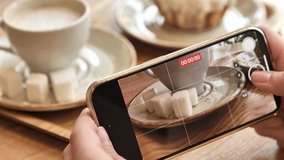 Close up of Woman Hands Taking Photos and Filming Videos Of Cup of Coffee and cubes of sugar with phone. Closeup. 4K. High quality 4k footage