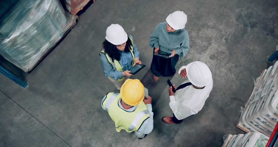 People, engineer and tablet in teamwork, supply chain or collaboration for storage management above. Top view of group, contractors or technicians in discussion with technology for quality control