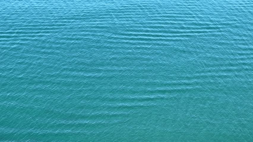 Blue sea water calm rippled surface background.