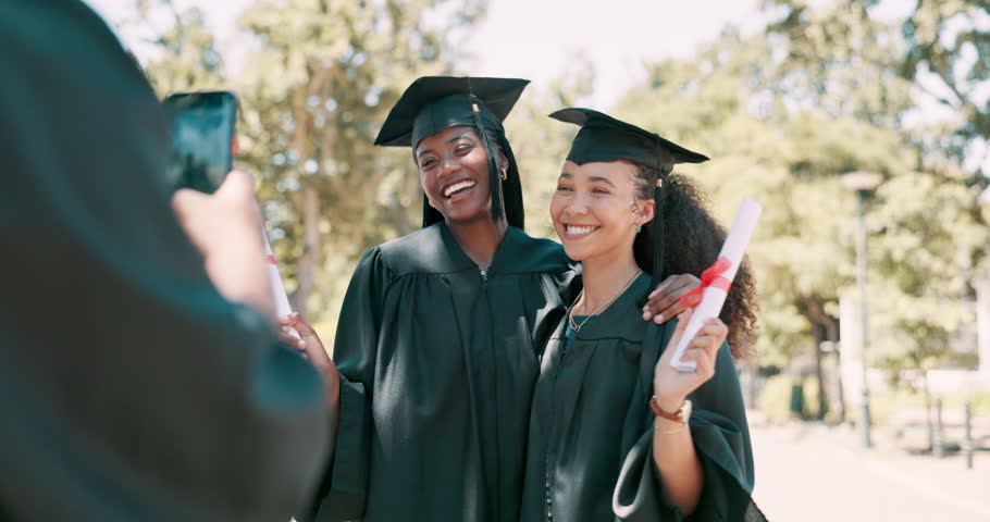 University, graduation and women with phone for photo on campus for learning, education and celebration. College, academy and students take picture for social media, online post or memory with degree