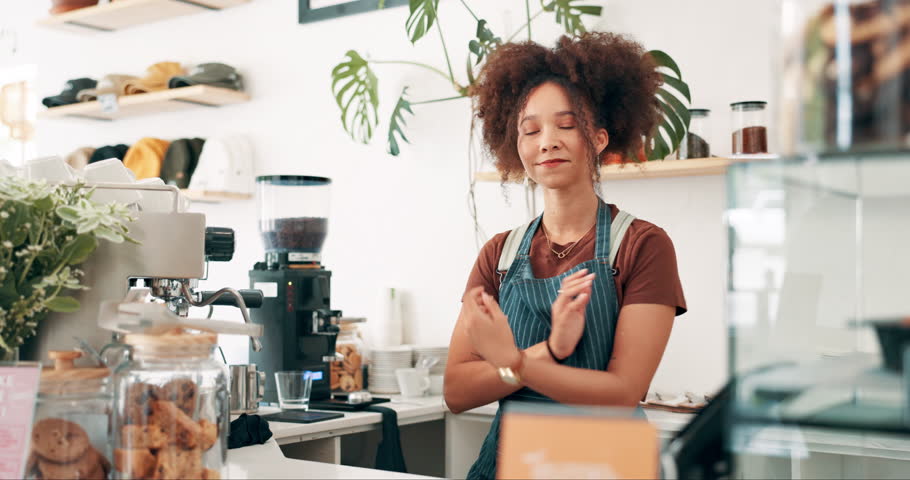 Woman, cafe business owner and arms crossed at counter for welcome, customer service and confidence in startup. Portrait or face of waitress, barista or cashier at a bakery, restaurant or coffee shop Royalty-Free Stock Footage #3430748753