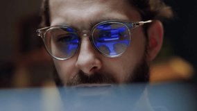 Close up eye reflection. Focused crypto trader analyst wearing eyeglasses working looking at computer screen reflecting in glasses analyzing online trading stock exchange market data charts. - Powered by Shutterstock - Get 15% off with code: PIKWIZARD15