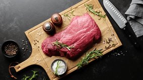 Beef meat entrecote on a cutting board, raw beef meat fillet on kitchen desk, stock footage video 4k