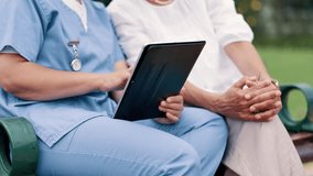 Nurse, tablet and patient outdoor for healthcare, help or support people in nature. Tech, caregiver or closeup of hands by park bench in garden for rehabilitation, medical care or test results on app - Powered by Shutterstock - Get 15% off with code: PIKWIZARD15
