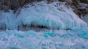 Aerial drone view frozen winter Lake Baikal. Blue transparent ice deep cracks top view. Natural cold background of ice. Winter abstract background. High quality 4k footage - Powered by Shutterstock - Get 15% off with code: PIKWIZARD15