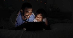 Night, tablet or father and daughter in a bed with movie, streaming or video search at home. Love, happy family and dad with kid in bedroom for digital, reading or ebook storytelling, app or bonding