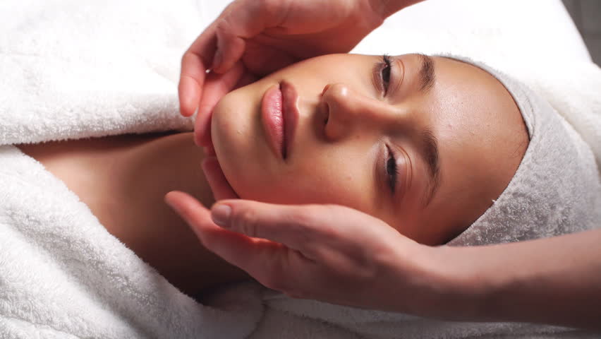 Beautiful Young Woman Relaxing Female Receiving Facial Body Massage Beauty Spa. Royalty-Free Stock Footage #34310398