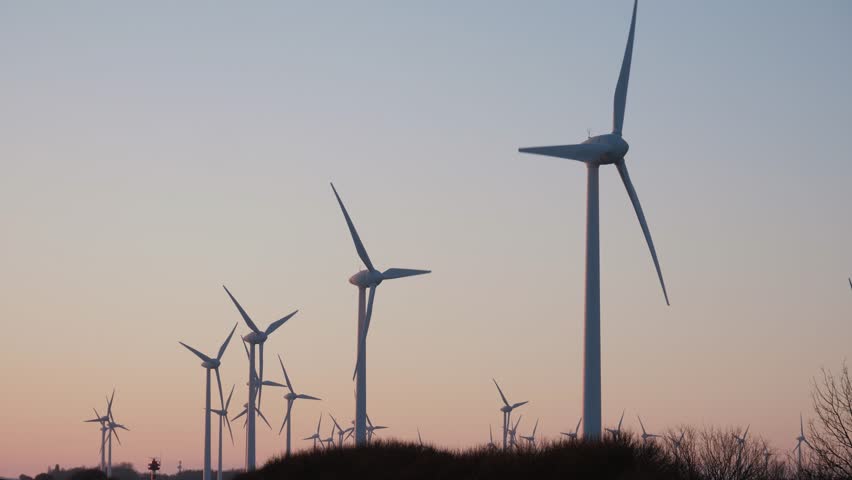 Windmill turbine park at dusk, low angle windmill park. Green energy Eolic farm production, copy space Royalty-Free Stock Footage #3431043241