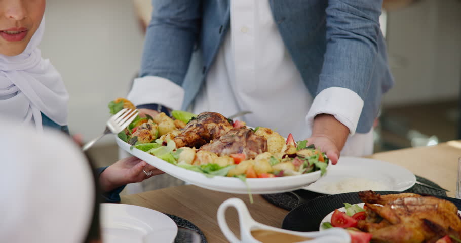 Share, food or hands of family in a home with lunch, plate or celebration in social gathering event. Group of Muslim people, eating or dish closeup with dinner, meal or brunch with nutrition or feast Royalty-Free Stock Footage #3431116205