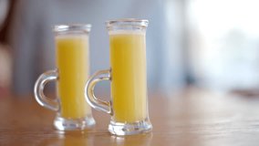 Two vitamin ginger immunity shots on table - Powered by Shutterstock - Get 15% off with code: PIKWIZARD15