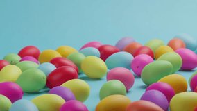 Pastel easter eggs fallen on blue background. - Powered by Shutterstock - Get 15% off with code: PIKWIZARD15