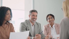 Happy busy executive team, diverse office workers people having business meeting, consulting client, hr recruiting group having onboarding interview, providing consultancy services in office. - Powered by Shutterstock - Get 15% off with code: PIKWIZARD15