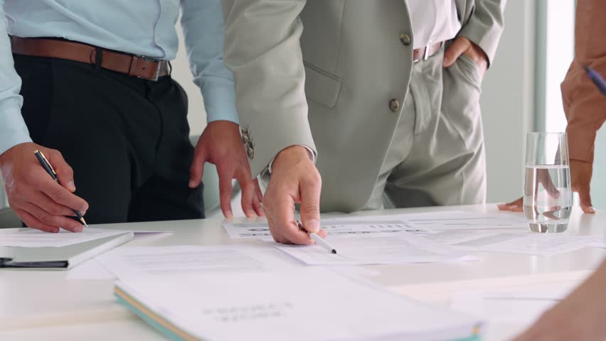 Executive business team people group working with paperwork standing at table, analyzing corporate strategy concept, reviewing plan, managing financial project overview at office meeting, close up.