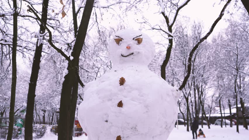 snowman in a public park. 4k video. Royalty-Free Stock Footage #3431410609