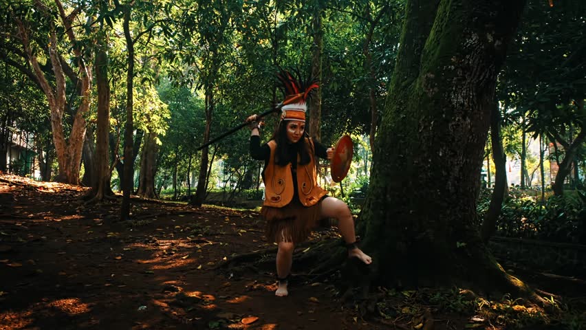 Person in tribal attire with a headdress in a lush forest setting, evoking a sense of adventure and cultural heritage in the morning