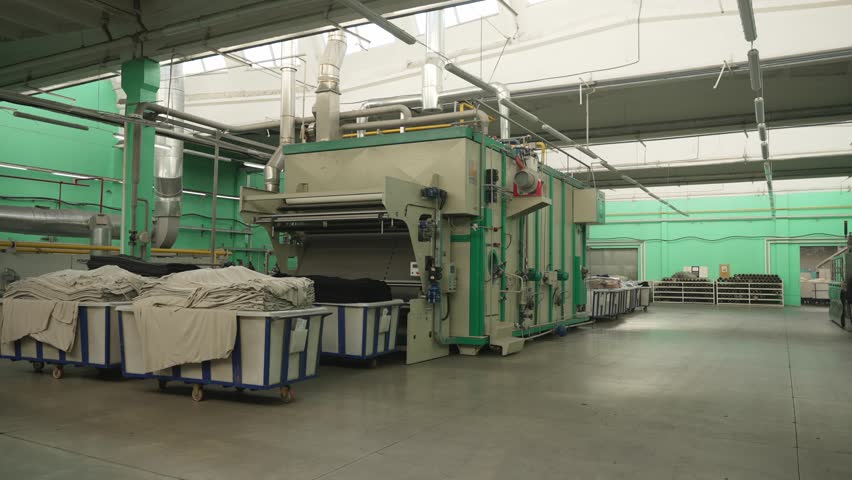 Industrial Laundry Facility with Machinery and Linen Baskets. Concept Industrial Cleanliness