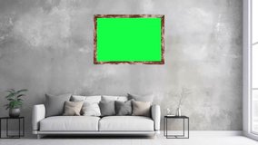 Zoom in Shot of a wall frame with Horizontal Green Screen Mock Up. Living Room with a Sofa and plant.