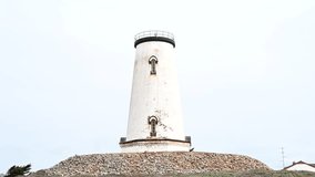 4K HD hand held video zooming in on Piedras Blancas lighthouse on the California central coast at Point Piedras Blancas, about 5.5 miles west by northwest of San Simeon, CA.