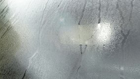 condensation dew glass car water wet windshield window rain rainy mist moist vehicle drops moisture fog transparent light close-up video clean stream condensate climate humid drip motion closeup drop