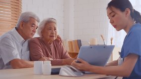 Asian caregiver examine depress senior crying woman patient and husband. Attractive specialist career girl support give advise and consult to older elderly mature couple with disease in living room.
 - Powered by Shutterstock - Get 15% off with code: PIKWIZARD15