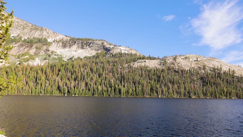 Camera moves past the beautiful landscapes of Yosemite National Park in California.