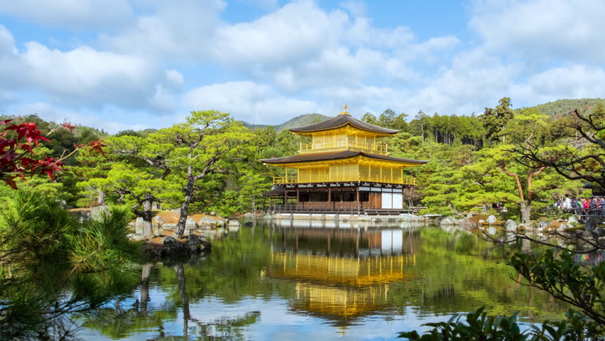 Kinkakuji temple on a pond, Kyoto, Japan. Time lapse video in autumn season on a sunny day.