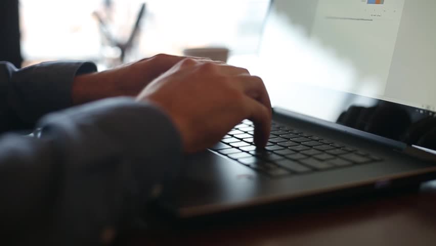 Camera slides around freelancer's hands typing on laptop keyboard in slow motion. Businessman working at office with internet. Man searches new job on internet at coffeeshop. Business concept. | Shutterstock HD Video #34317625