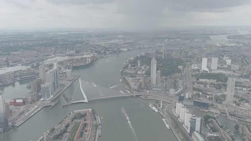 A-Log. Rotterdam, Netherlands. Erasmus Bridge. Noordereiland Island. View of the city center. River Nieuwe Maas. Summer day, Rainy clouds, Aerial View