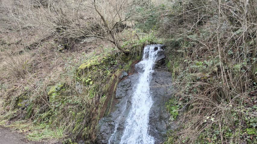 aerial man waterfall. High quality 4k footage