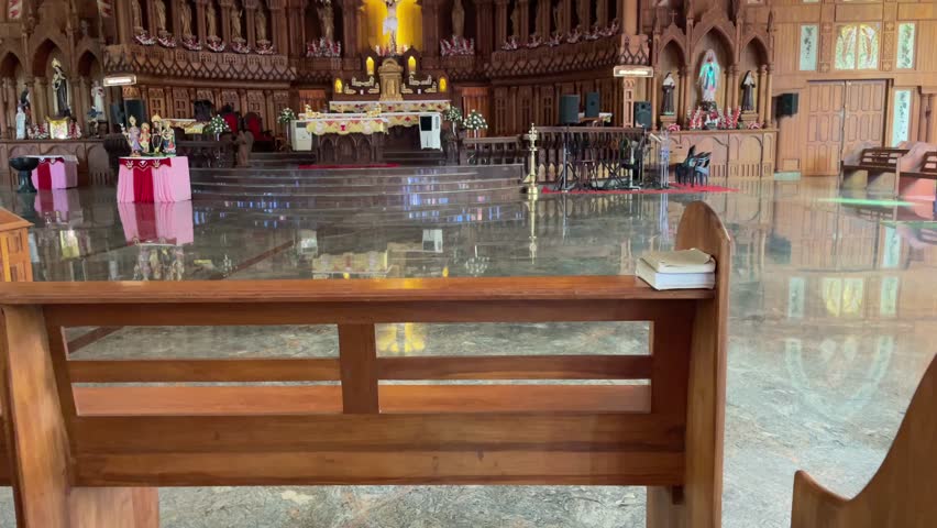 The serene interior of a beautifully decorated Catholic church with wooden pews, a shining marble floor, and an ornate altar in the background , Inside view of a beautiful Church in Thrissur