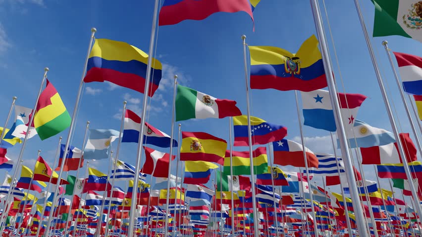 Flags blowing in the wind. А lot of national flags of Spanish speaking countries.