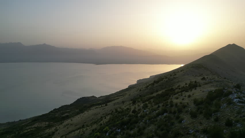 Montenegro. Autumn. Sunset over Skadar Lake. Shooting from a drone. Height of 750 meters above sea level. Video 4k.