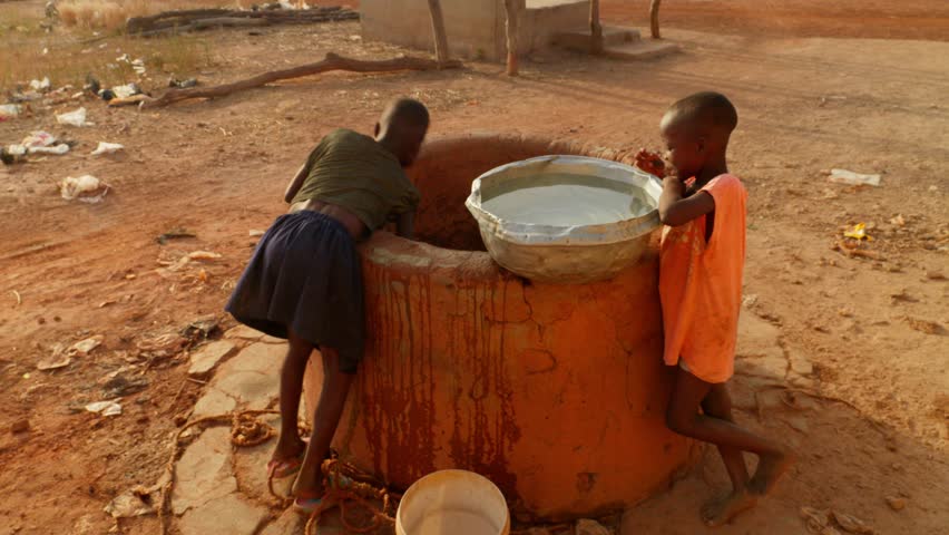 African children filling up a plastic container at a water well in Rural, Africa Royalty-Free Stock Footage #3432005215