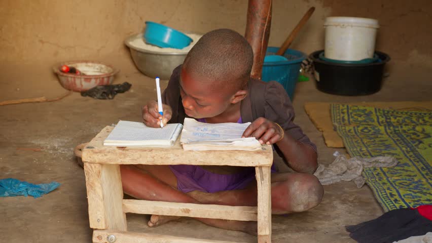 african instruction school concept black child kid studying alone writing on notebook in his house in remote village Royalty-Free Stock Footage #3432006883